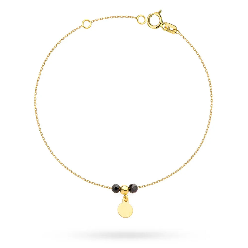 Zlatý náramek s kruhovými korálky