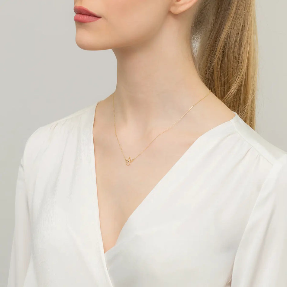 Zlatý náhrdelník s diamantovým andělem