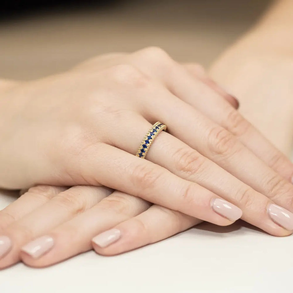 Gold Ring Set with 15 0.03ct Sapphires