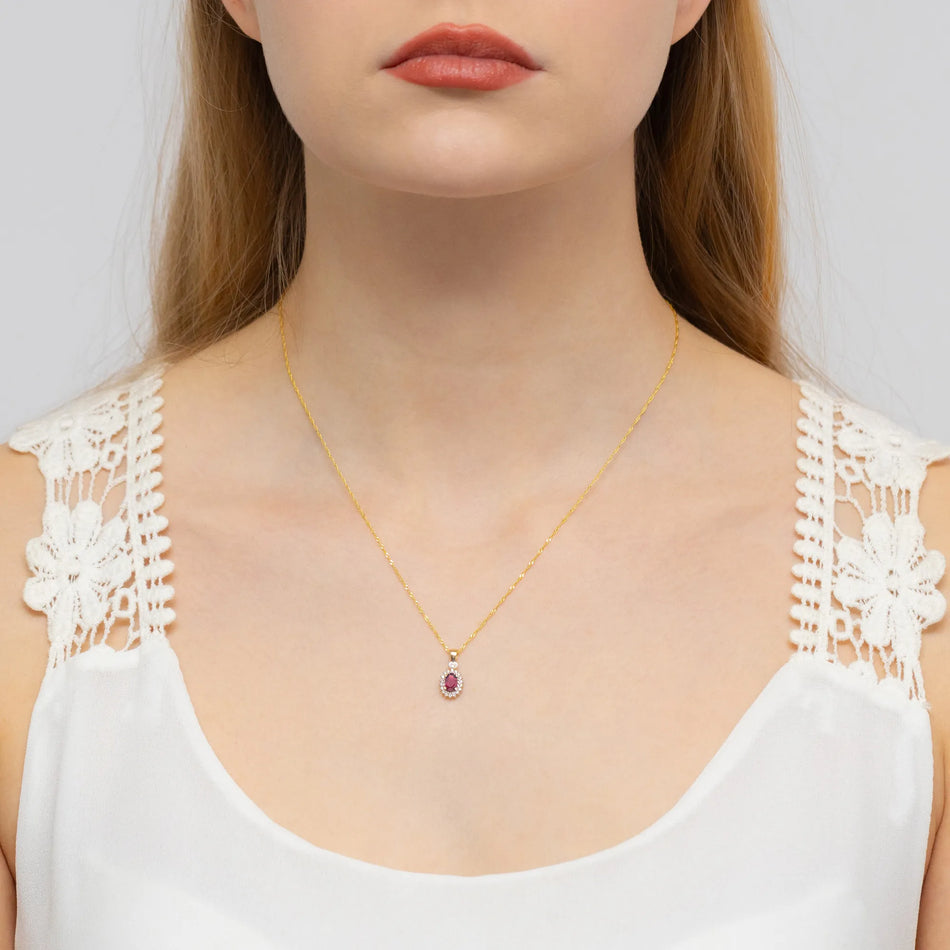 Zlatý přívěsek s rubínem 0,60 ct a diamanty 0,095 ct