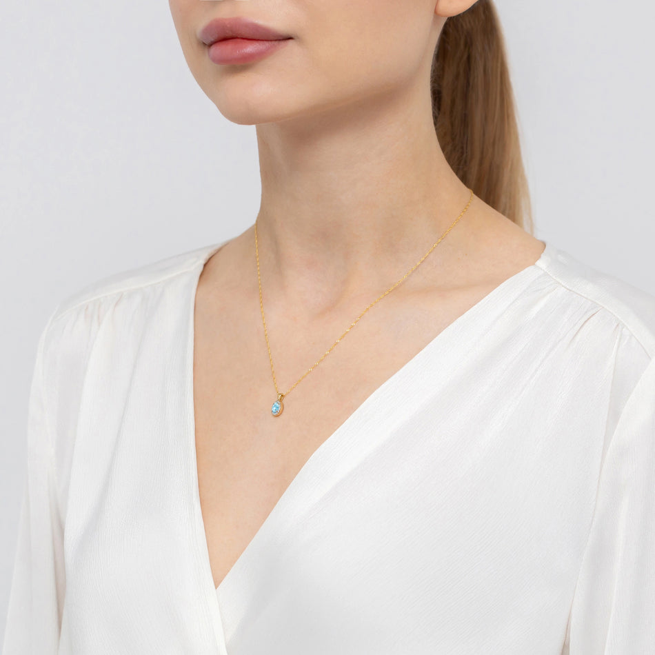 Zlatý přívěsek s topazem 0,50 ct a diamanty 0,08 ct